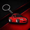 llavero deportivo roadster rojo sobre fondo negro y rojo
