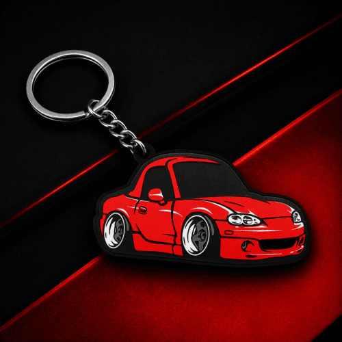 llavero deportivo roadster rojo sobre fondo negro y rojo